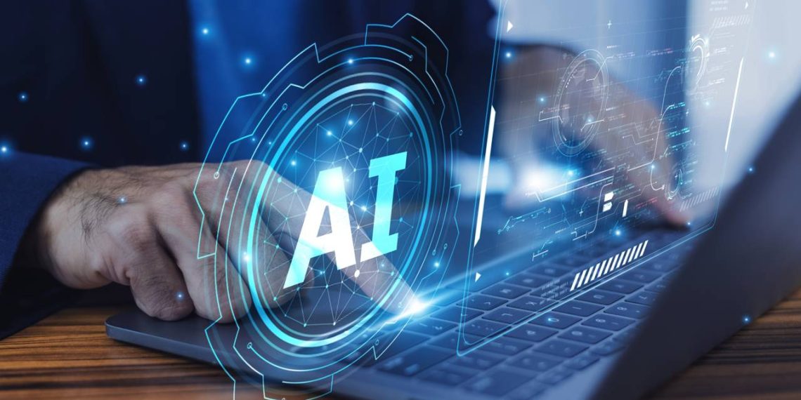 Homem usando IA no Laptop - Créditos: depositphotos.com / yokhanomwan@gmail.com