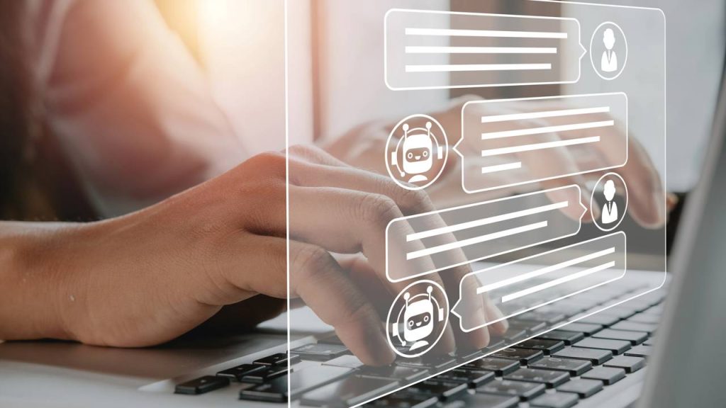 Pessoa conversando com IA no laptop - Créditos: depositphotos.com / mc_stockphoto.hotmail.com